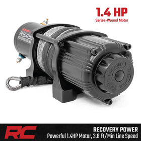 Rough Country winch beside a ruler showing compact size for space-saving fitment