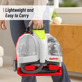 Rug Doctor spot cleaner in use on sofa lifting stains and reducing odors quickly