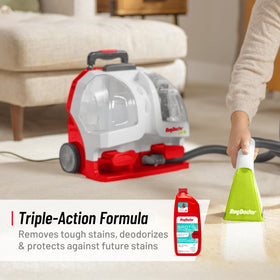 Rug Doctor unit next to trial solution bottle highlighting pet stain treatment pairing
