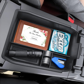 RUNROAD tray holding phones and wallets for faster access on the road