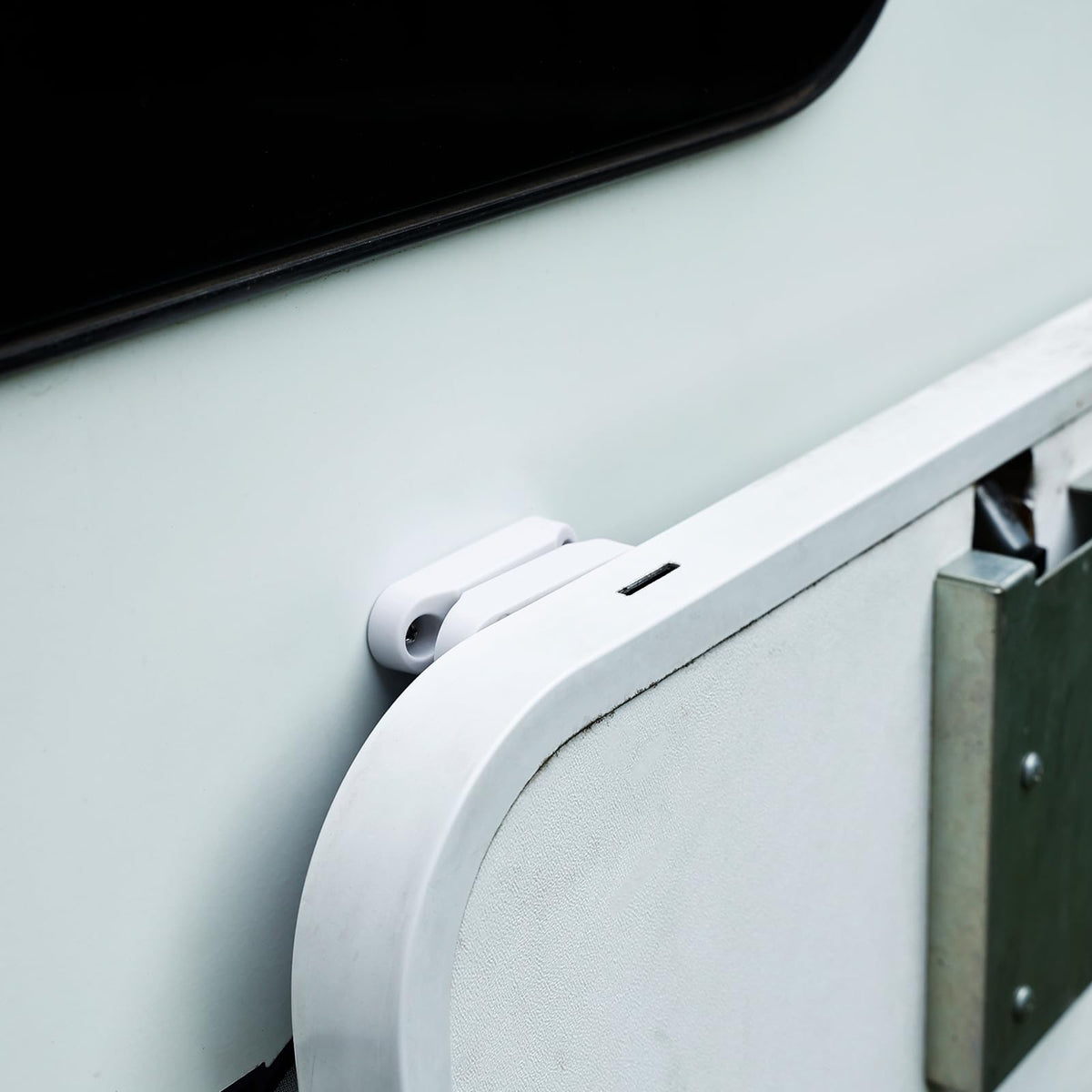 RVGUARD door catch in camper scene preventing slamming while loading benefit