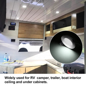 RVZONE puck light in hand for size comparison showing compact scale benefit for tight spaces