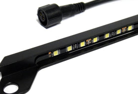 RZG lamp mounted on car at night providing even plate illumination