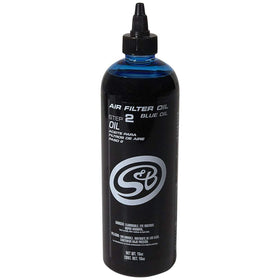 S&B blue oil applicator close-up showing calibrated measurement for accuracy