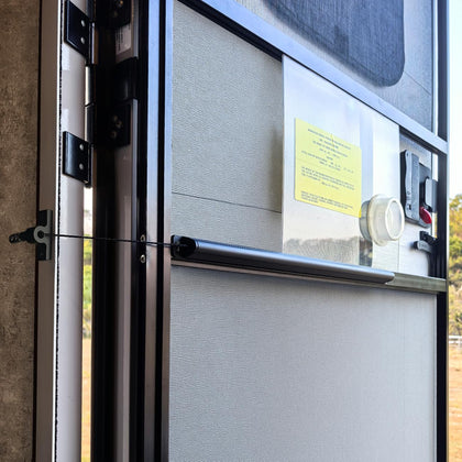 Safoner front view mounted on RV screen door showing neat fit and quick closure