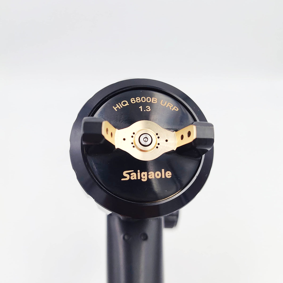 saigaole spray gun disassembled parts laid out for cleaning showing easy maintenance