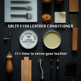SALTY FISH tin next to hand showing 7.5 oz scale and travel-friendly benefit