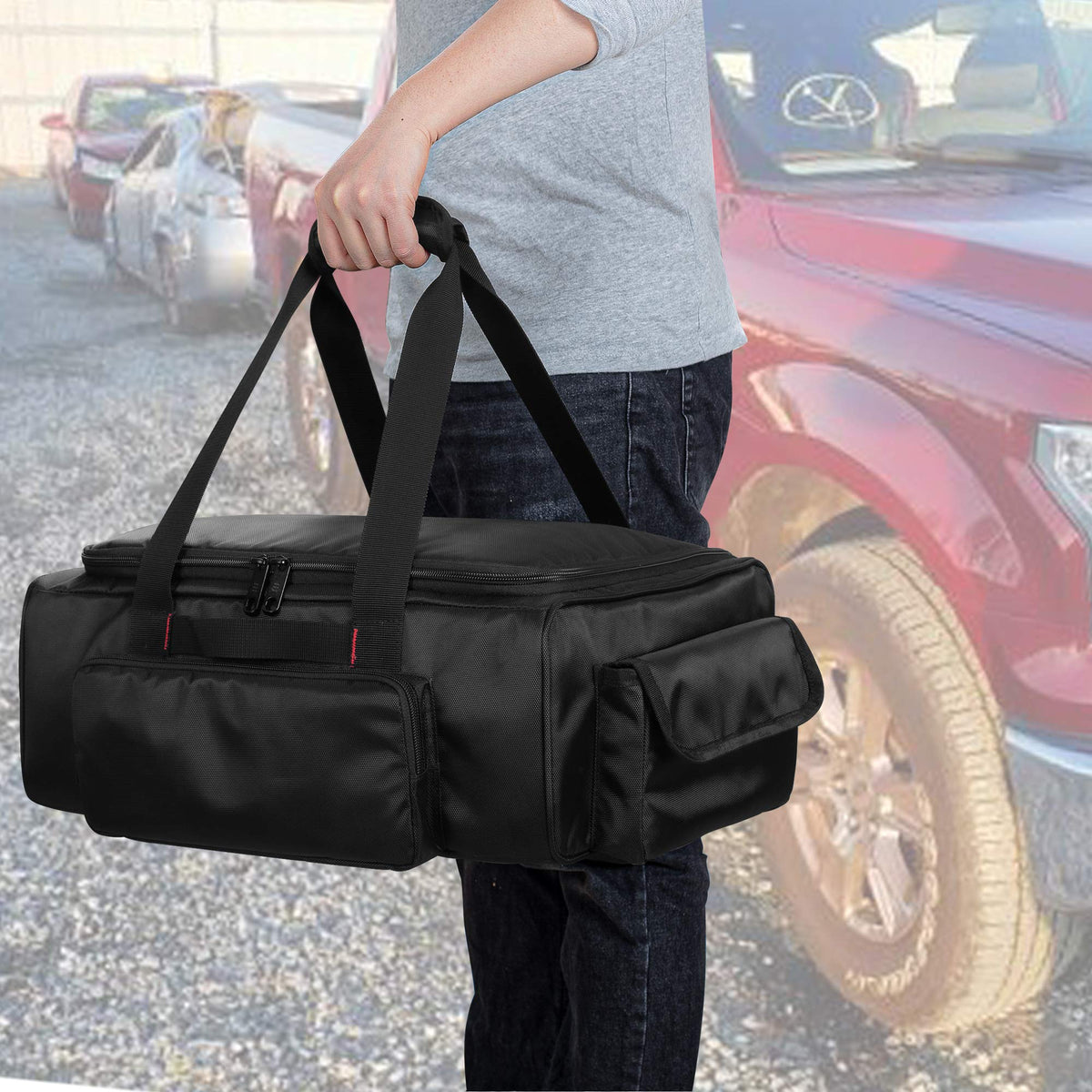 samdew bag beside tools showing scale and capacity for jumper cables benefit