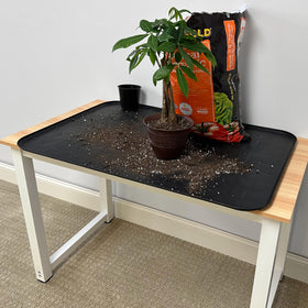 Scepter tray used during an oil change reducing spills and keeping floors clean
