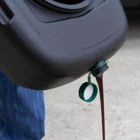 Scepter pan next to common objects showing 12‑quart capacity and compact size