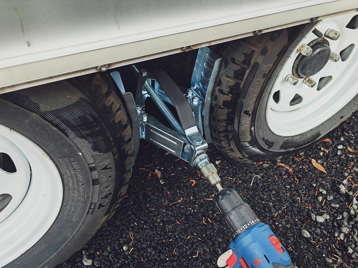 Schumaho chocks installed on camper wheel providing added stability