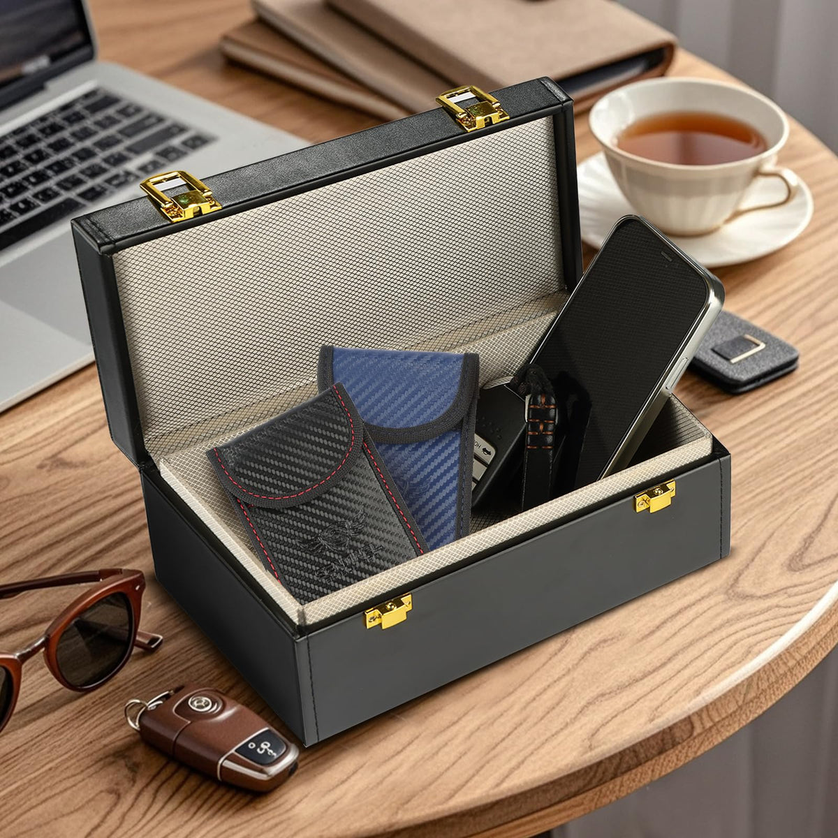 Sentinel Shield Pro red pouch on table shows easy grab-and-go protection for key fobs