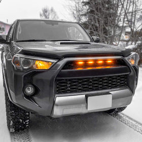 SEVEN SPARTA LED next to a hand for size comparison and easy fit reassurance