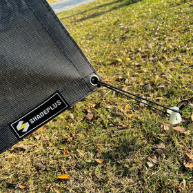 SHADEPLUS anchored with stakes illustrating stable tension and reduced wind flap