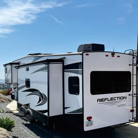 SHADEPLUS fabric on camper at campsite, improves appearance and weather protection