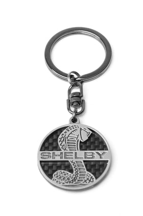 Carroll Shelby front pendant on carbon fiber showing logo and premium finish