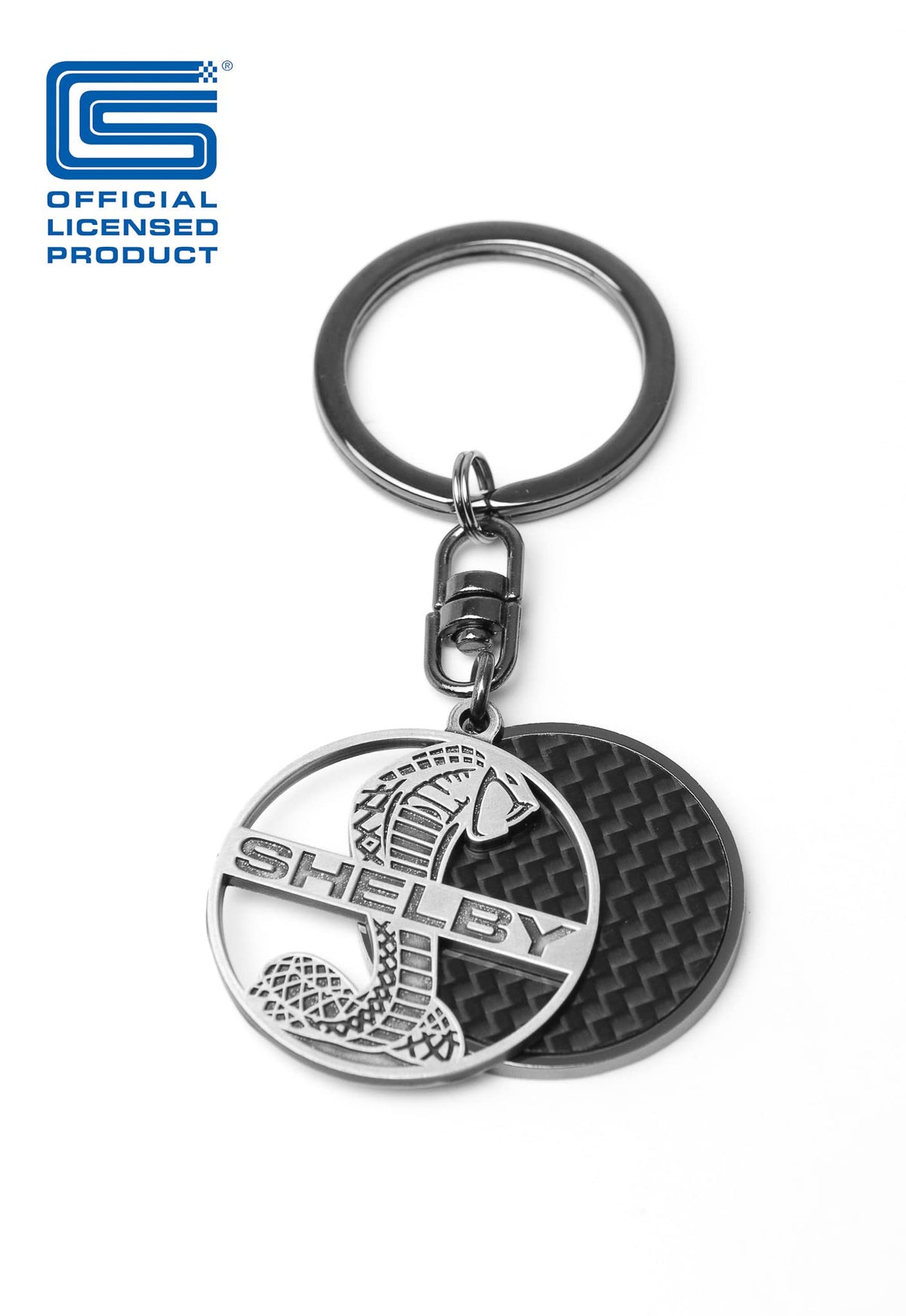Carroll Shelby keychain on car dashboard adding vintage style to interior