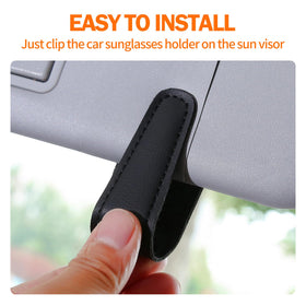 Shering holder attached to car visor with sunglasses secured for easy access