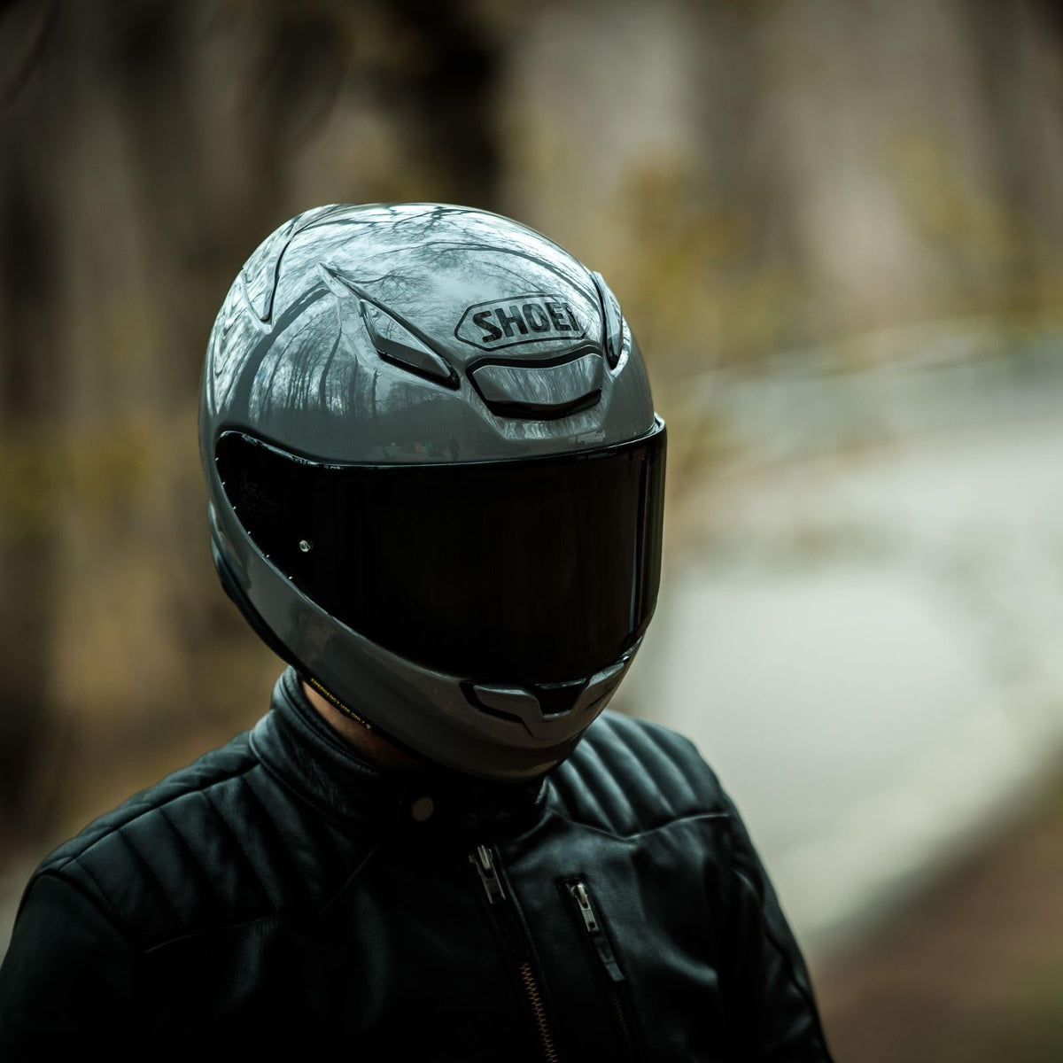 Shoei RF-1400 on rider on motorcycle showing real-world comfort and stability