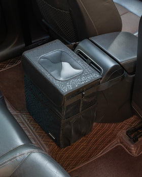 SIBOFUEGO hanging from car headrest in use keeping trash contained and cabin tidy