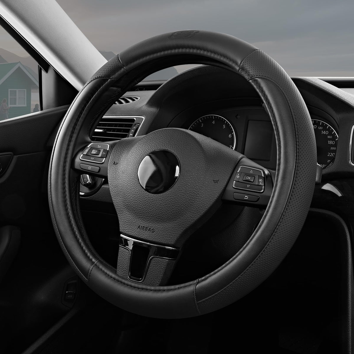 Skechers front view of black leather steering wheel cover showing refined look and comfort