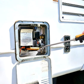 Skoutag technician using kit in an RV bay demonstrating simple preventive care