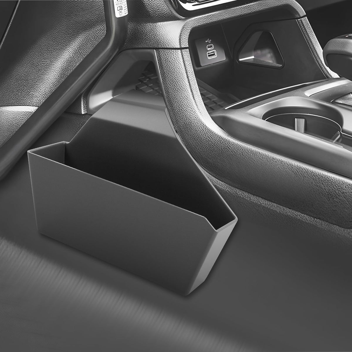 SKTU lifestyle shot driver reaching into console highlighting organized cabin