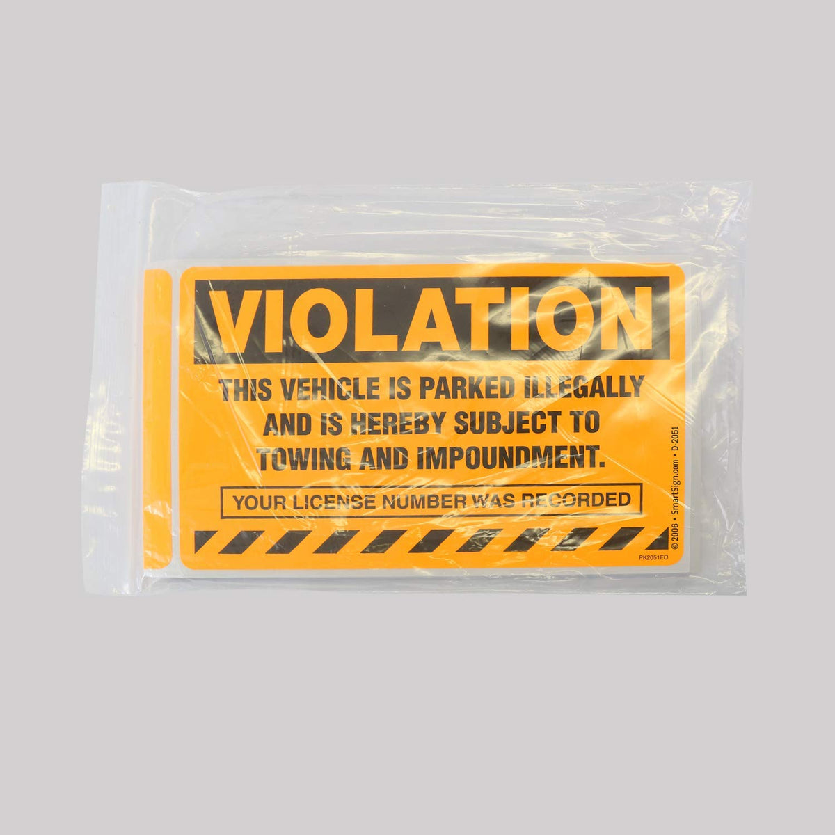 SmartSign sticker applied to windshield showing secure placement and visibility