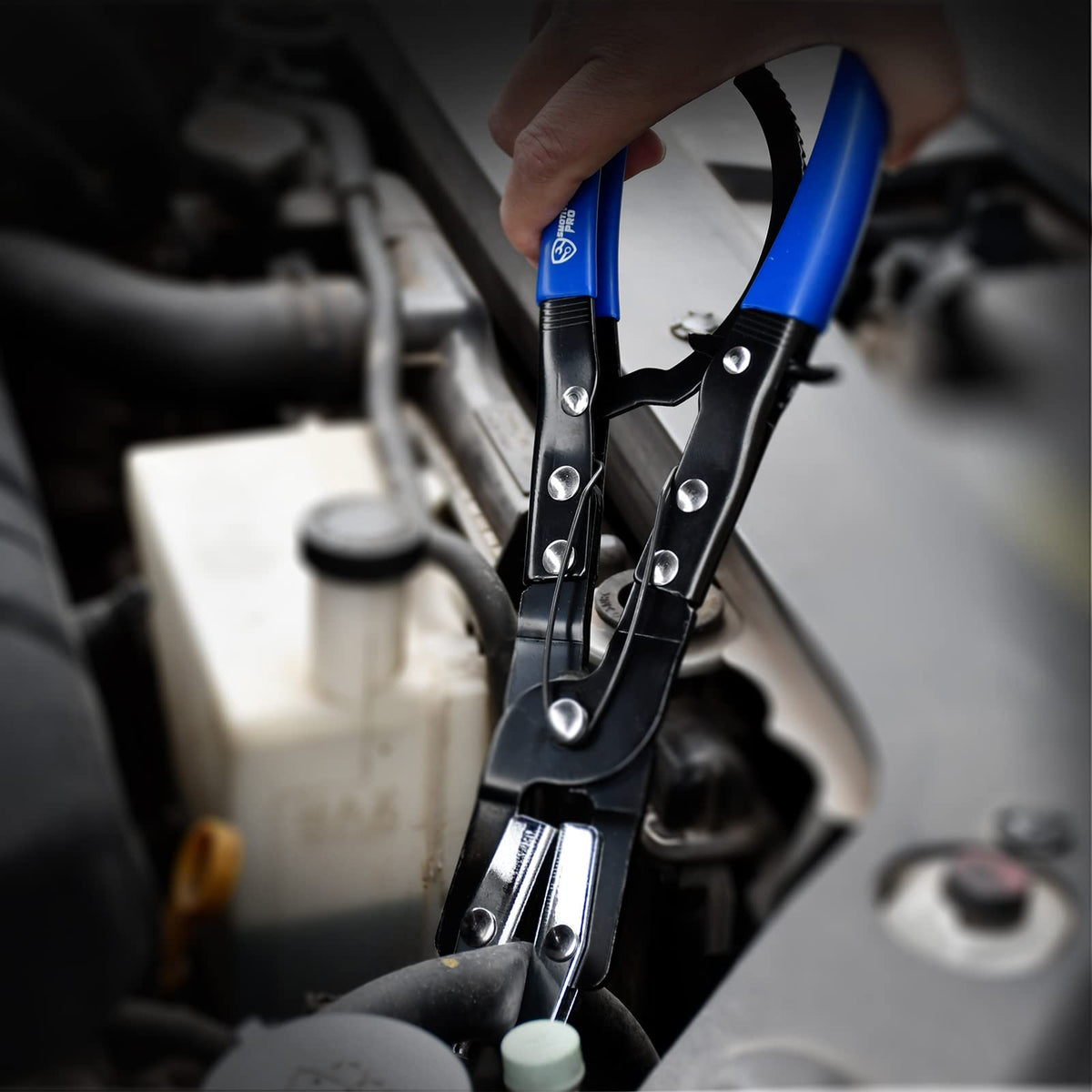 SMOTIVEPRO tools on garage workbench near parts showing professional-ready durability benefit