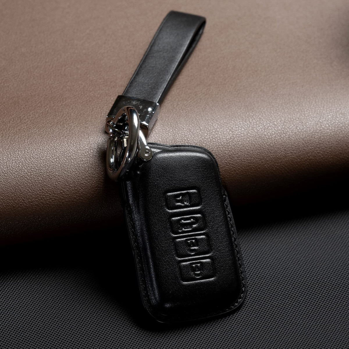 Smyfob held in hand with lanyard showing convenient carry and grip