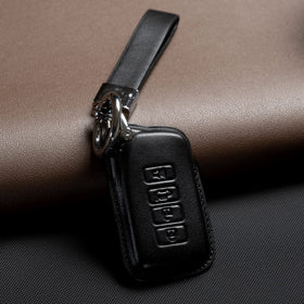 Smyfob held in hand with lanyard showing convenient carry and grip