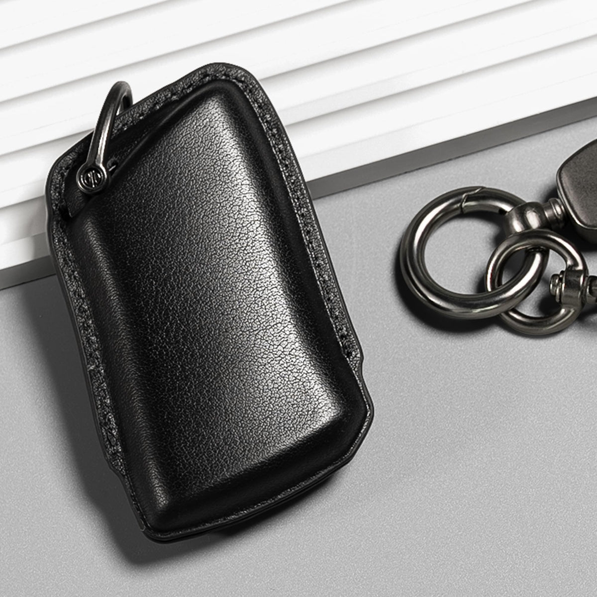 Smyfob key next to credit card showing slim profile and scale advantage