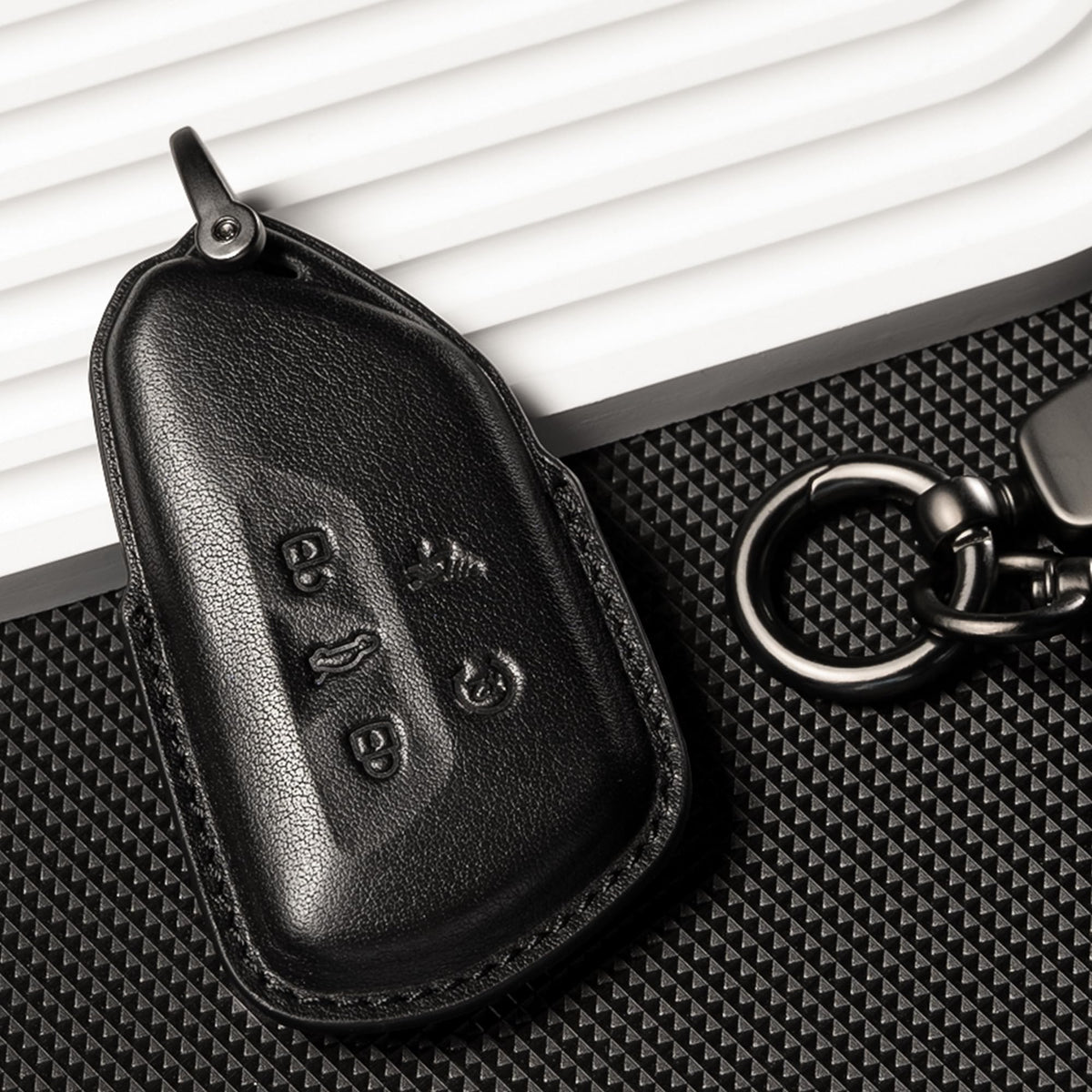 Smyfob size comparison next to a car key showing fit and scale advantage