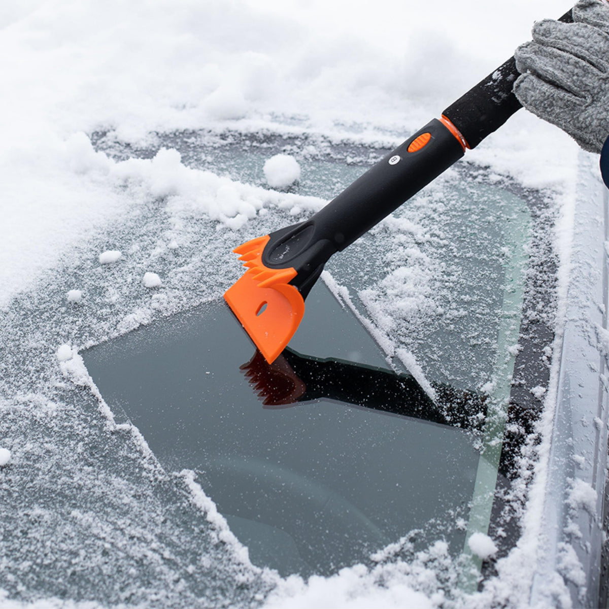Snow MOOver squeegee removing slush and water from a windshield for clearer view