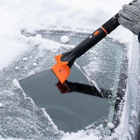 Snow MOOver squeegee removing slush and water from a windshield for clearer view