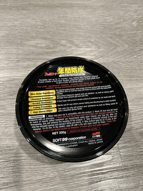 SOFT99 tin held in hands to show size and travel-friendly convenience