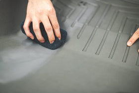 Hand holding 12 oz bottle showing size and easy-application benefit from Solution Finish