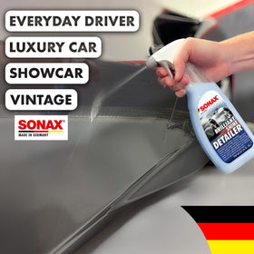 Hand holding SONAX 750ml bottle showing scale and convenient grip for use