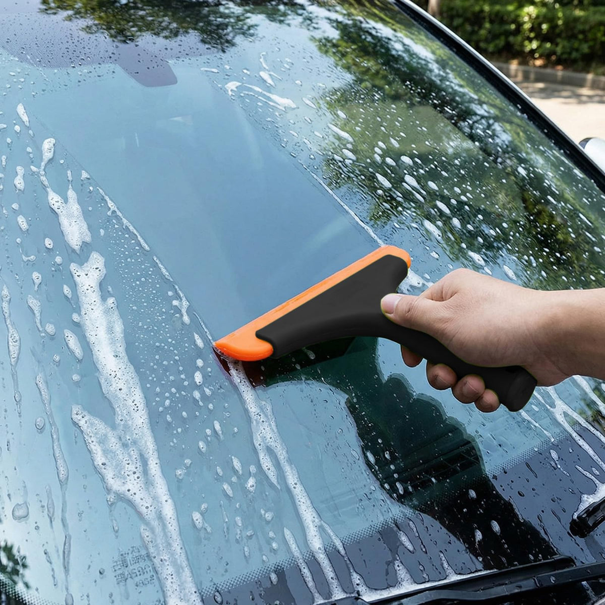 Spanno Tools silicone squeegee on a curved panel improving film conformity