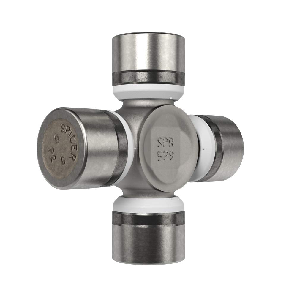 Spicer U-joint next to ruler showing 3.219-inch bearing-cap-to-cap spacing benefit
