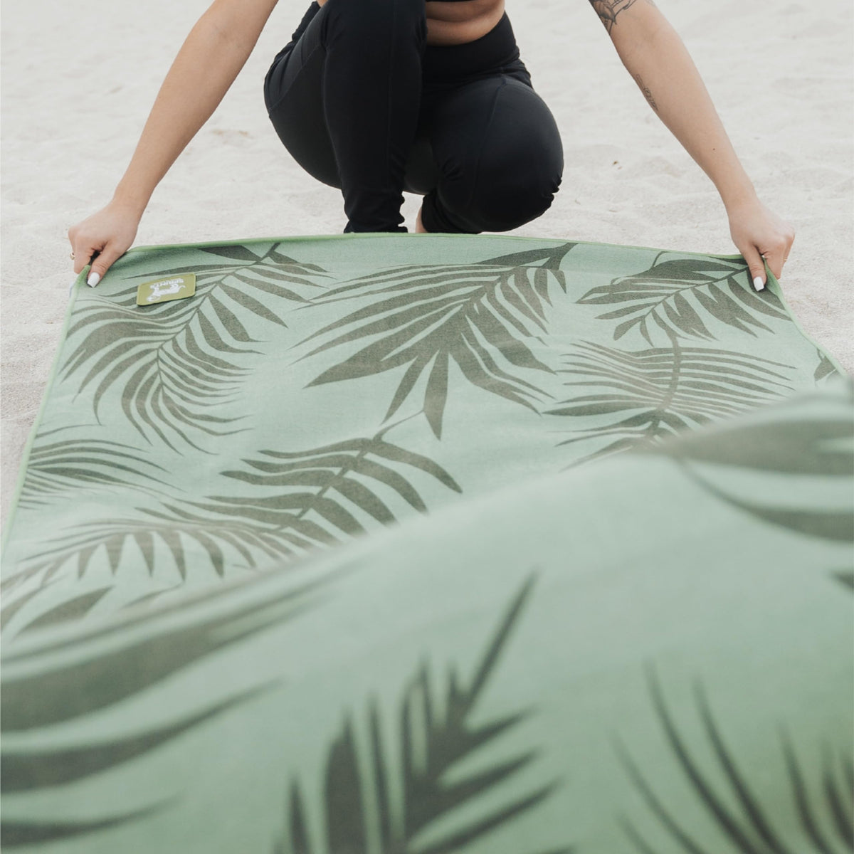 Sprints towel in beach setting showing versatile outdoor protection