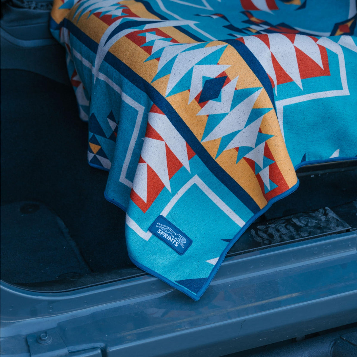 Sprints woven label and care tag showing machine-washable durability benefit