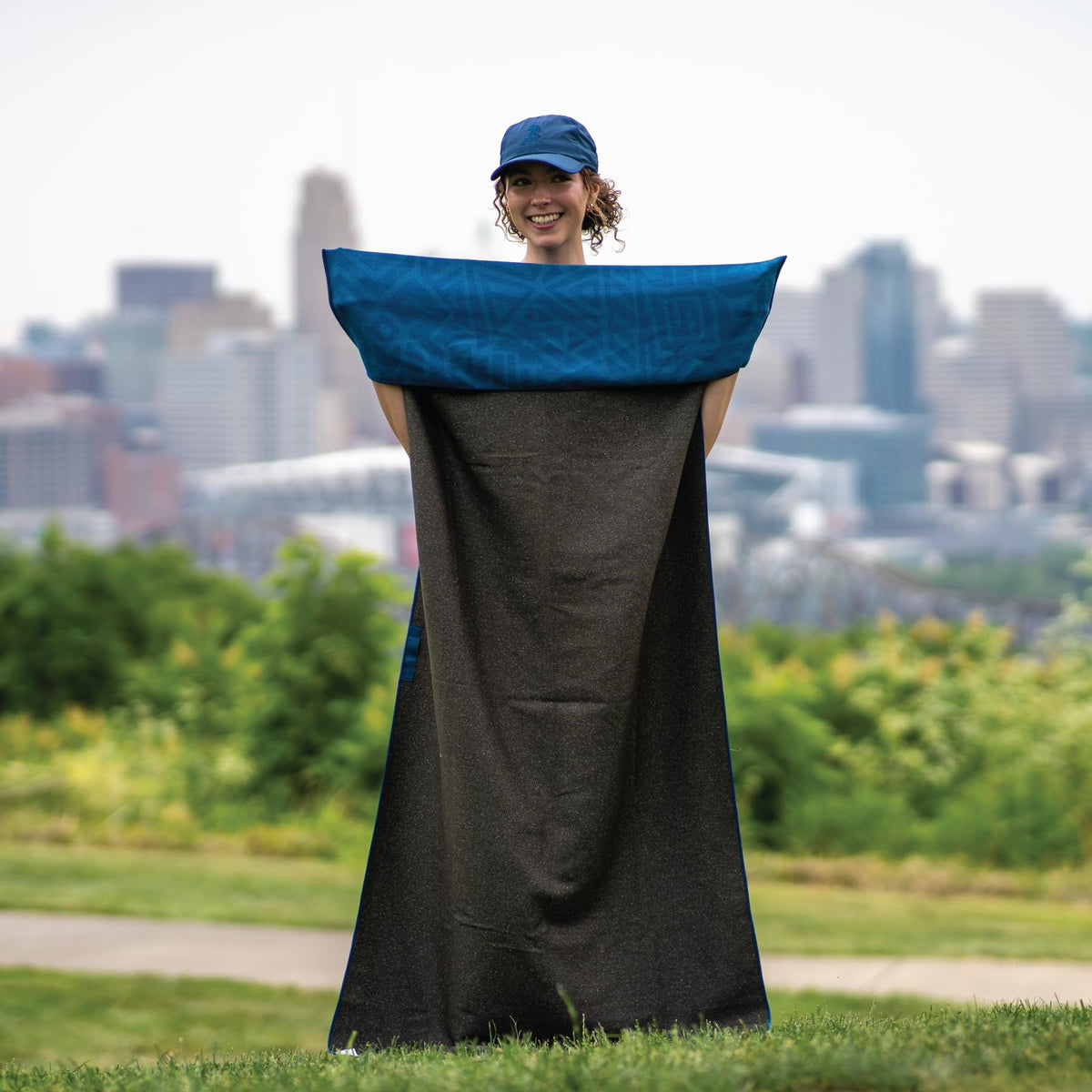 Sprints towel spread on beach showing versatile outdoor use benefit