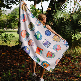 Sprints towel draped on beach chair keeping sand and moisture off