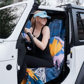 Sprints towel in car with runner loading gear showing travel convenience
