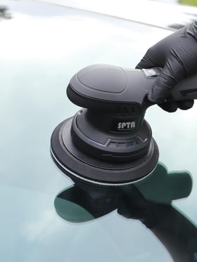 SPTA detailing workspace with pads and polish showing professional-grade results at home