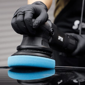 SPTA pad in a garage setting demonstrating professional DIY polishing workflow