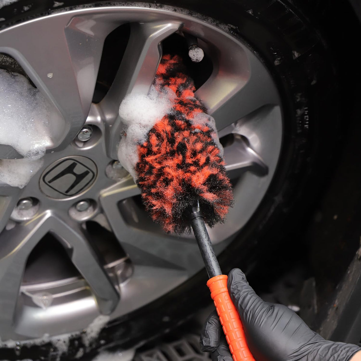 SPTA brushes used on vehicle wheel showing professional-detailing result