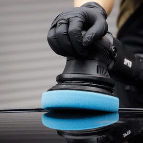 SPTA pad held in hand to show scale and comfortable handling benefit