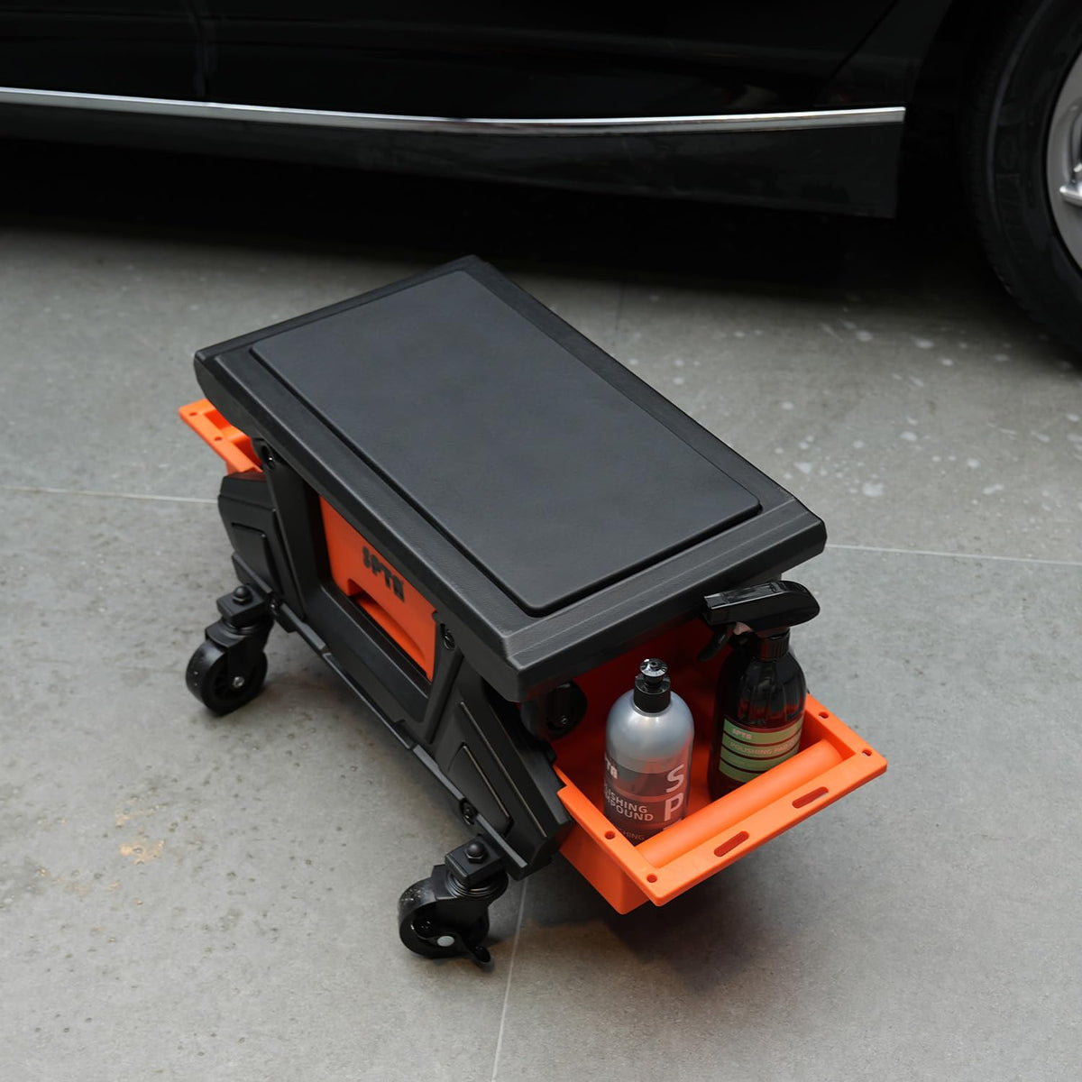 SPTA size and scale with ruler beside stool, demonstrates compact footprint
